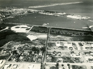 Aerial view of a shoreline with a bridge