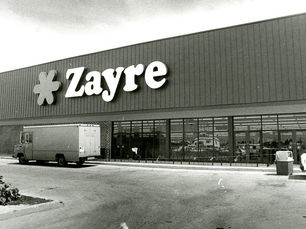 a storefront with a large sign that reads Zayre