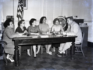 A group of people sitting around a table