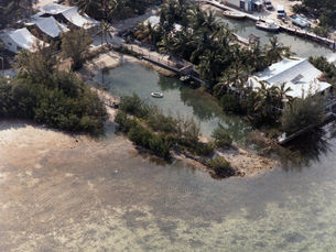 aerial view of a shoreline with an enclosed lagoon