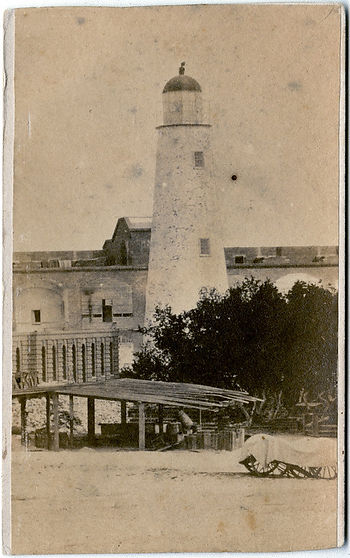 A lighthouse inside of a brick fort
