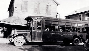 A bus with lettering on the side that reads The Key West Electric Co. 53