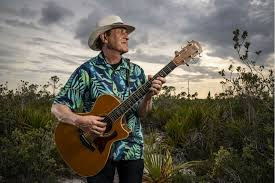 A man plays guitar