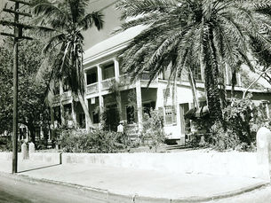 A two-story building with porches on both levels