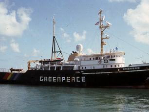 a ship with greenpeace written on the side and bow