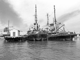 Two large vessels at dock.